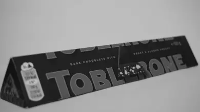 A black and white photo of a tube of toothpaste