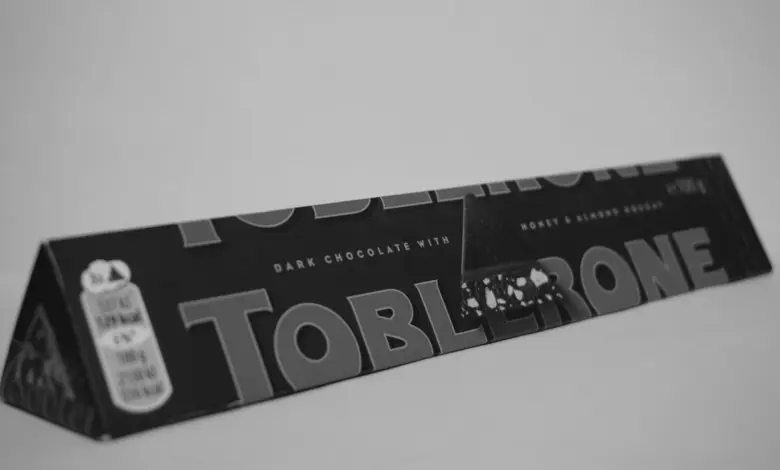 A black and white photo of a tube of toothpaste