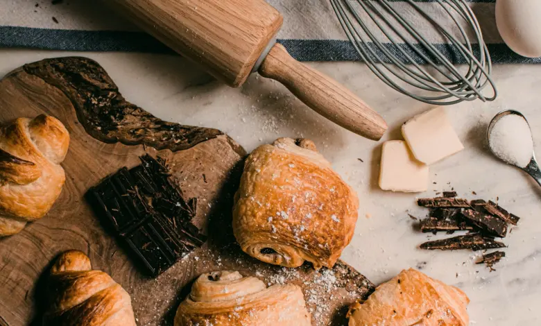 brown wooden rolling pin beside brown wooden rolling pin